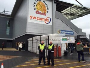 Security officers managing crowd at a UK sporting event